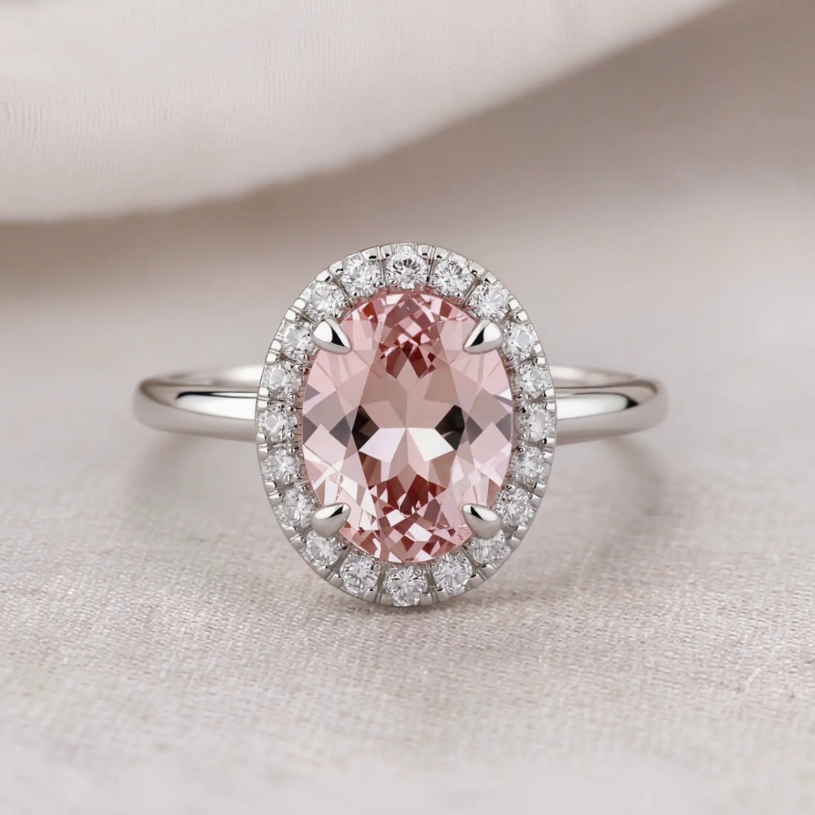 Morganite Engagement Ring Featuring a Soft Pink Oval Gemstone with Halo Setting