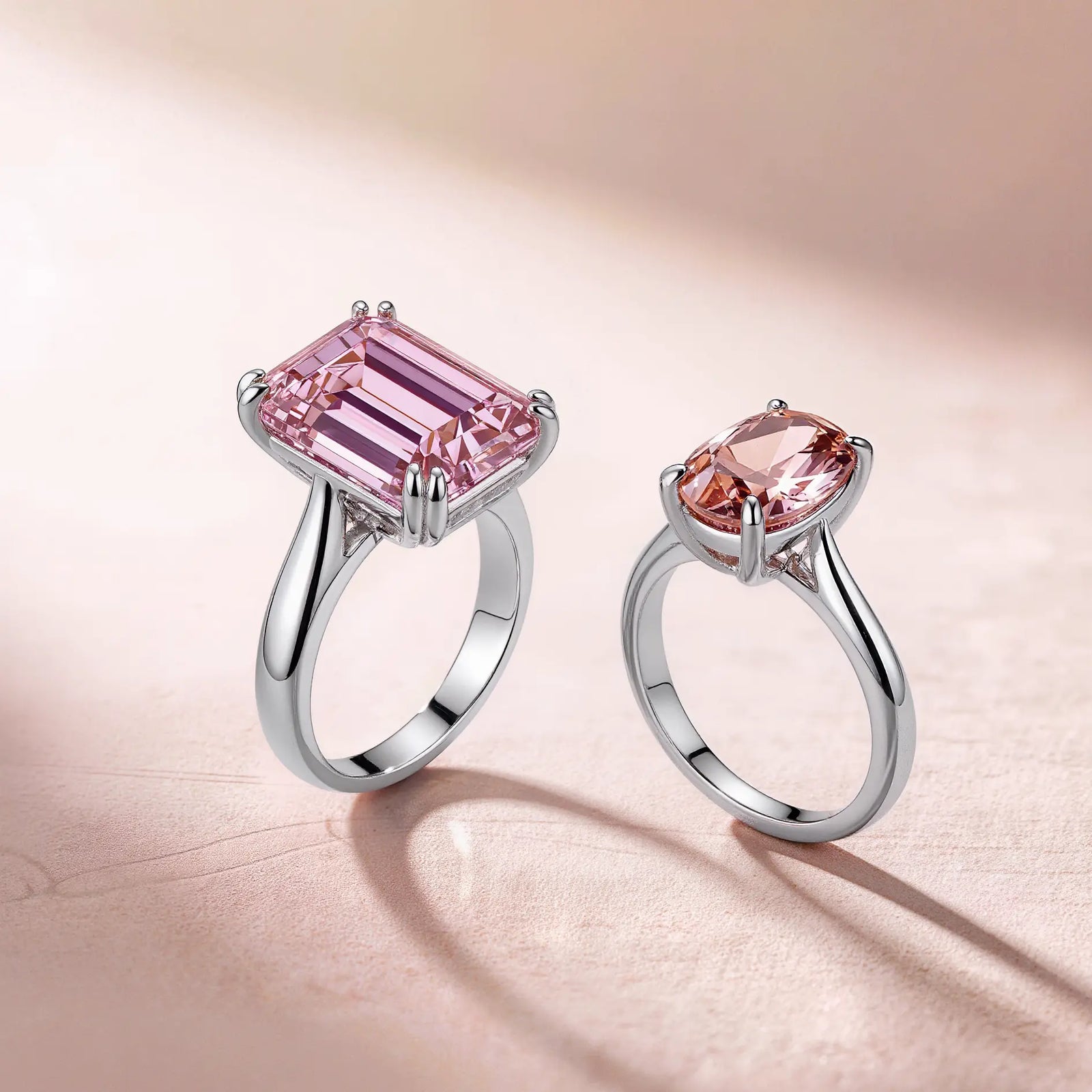 Two exquisite pink gemstone engagement rings featured in image_180ce5.jpg: a structured rectangular pink beryl ring and a romantic oval morganite band on a soft textured backdrop.