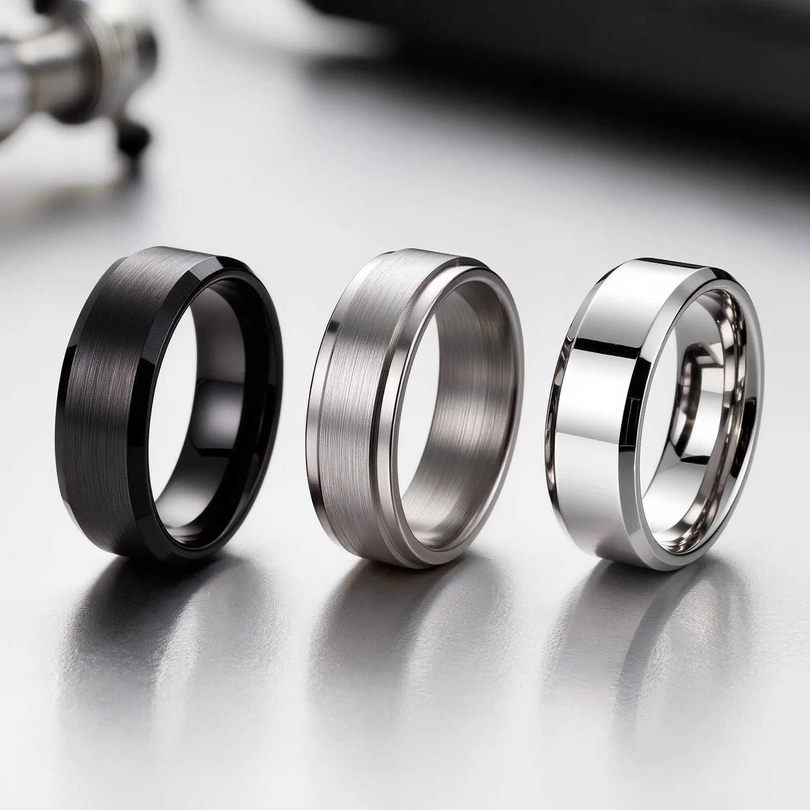 Tungsten Carbide, Titanium and Stainless Steel Men's Rings Displayed Side by Side