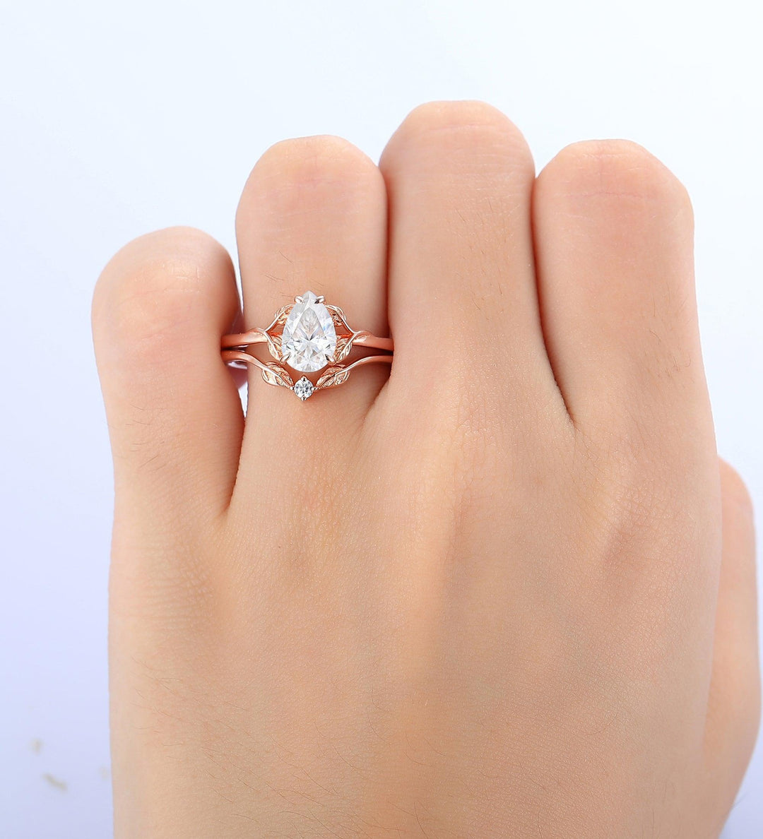 How to wear a pear shaped ring with wedding band?