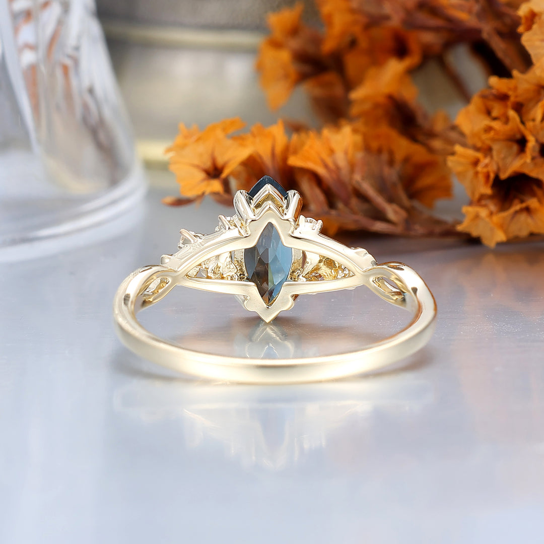 Fijne verlovingsring met London Blue Topaz en ginkgoblad, bruids- en jubileumring
