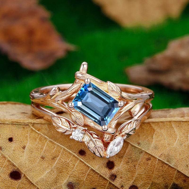 1 CT Emerald cut Split Shank London blue topaz ring set - Esdomera