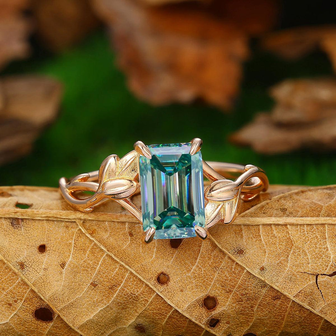 2.5 CT Emerald Cut Blue Moissanite 14K Gold Leaf Twist Solitaire Ring - Esdomera