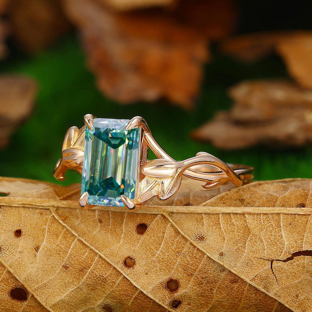 2.5 CT Emerald Cut Blue Moissanite 14K Gold Leaf Twist Solitaire Ring - Esdomera