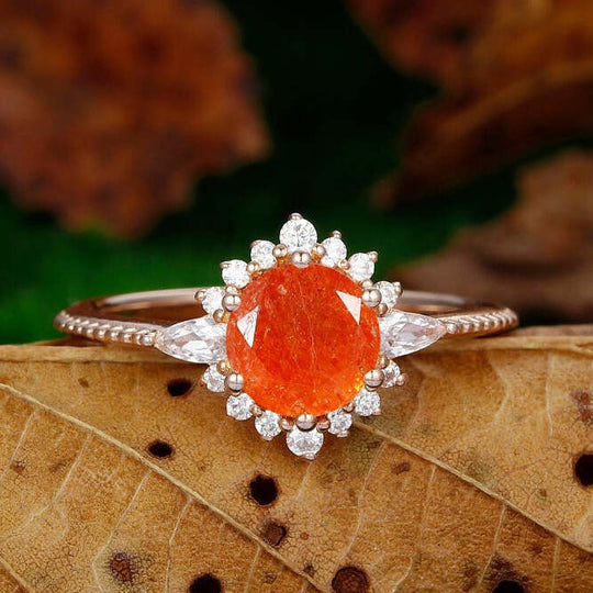 dainty 1.25ct round cut orange sunstone  nature inspired sunstone rose gold sunburst halo  Ring