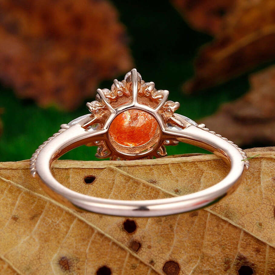 dainty 1.25ct round cut orange sunstone  nature inspired sunstone rose gold sunburst halo  Ring