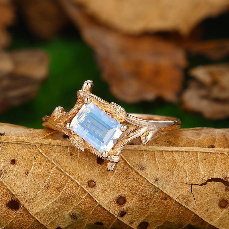 Solitaire Emerald Cut Bezel Set Moonstone Gold Split Shank Leaf Design Ring - Esdomera