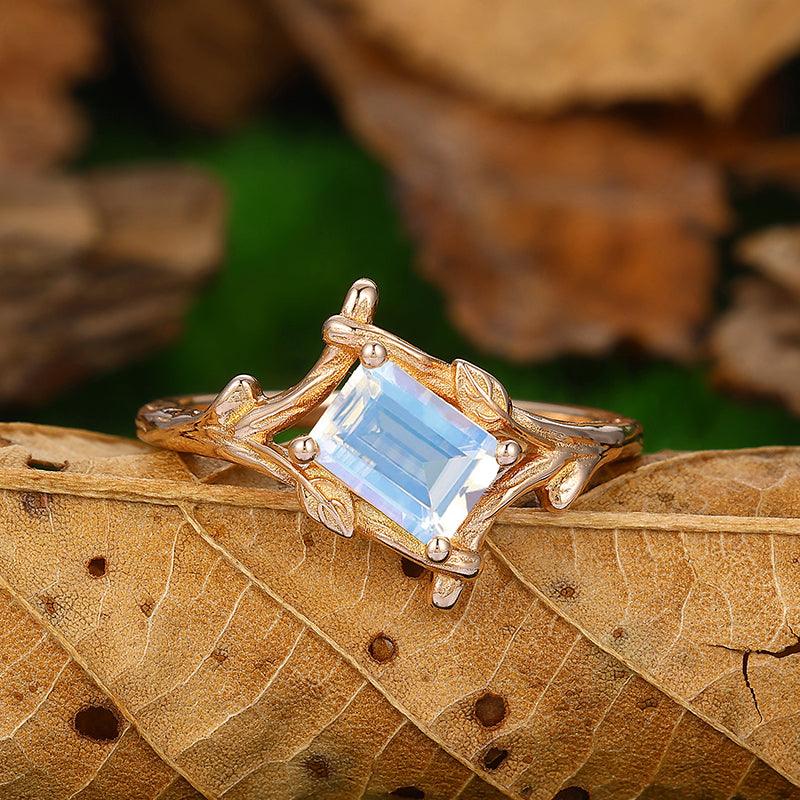 Solitaire Emerald Cut Bezel Set Moonstone Gold Split Shank Leaf Design Ring - Esdomera